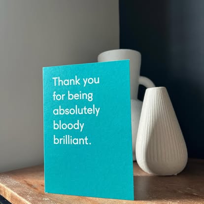 A thank-you card left for Tom by a customer, printed with the words 'Thank you for being absolutely bloody brilliant.'